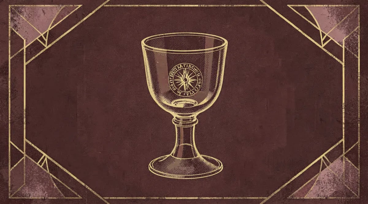 Tastevin de plata antiguo sobre mesa de madera con botella de vino de Borgoña